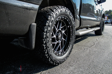 Nissan Titan with 20in Moto Metal M0985 Wheels and Venom Terra Hunter X/T Tires